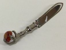 A silver letter opener with claw end. Approx. 11 grams. Est. £20 - £30.