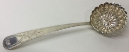 A large Continental silver sifter spoon. Approx. 64 grams. Est. £60 - £80.