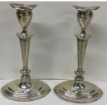 A pair of Adams' style silver candlesticks. Sheffield. Approx. 1215 grams. Est. £100 - £150.