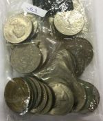 A bag of 28 commemorative Crowns. (coins)