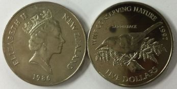 A New Zealand One Dollar 1986 together with a Royal visit Five Dollar 1997.