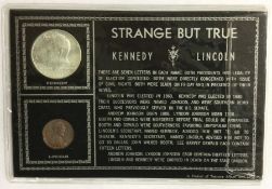 A 'Strange But True' Kennedy Half Dollar together with a 'Lincoln' One Cent.