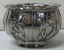 A novelty 19th Century Chinese silver bowl embossed with birds.