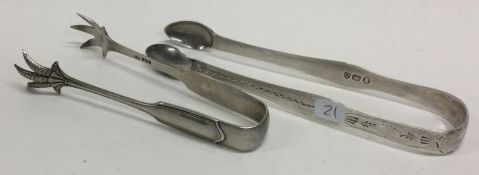NEWCASTLE: A pair of Georgian bright cut silver sugar tongs with one other pair.