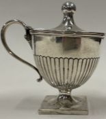 A Victorian silver fluted mustard pot. London 1892. By Horace and Woodward.
