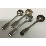 Four silver fiddle pattern salt spoons with double crest. London 1834. By WT.