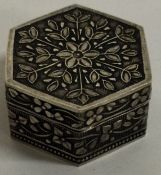 A chased silver box with lift-off lid. Approx. 21 grams.