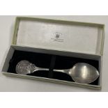 A heavy cased commemorative silver spoon embossed with a castle. London 1950.