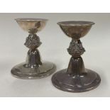 An unusual pair of silver candlesticks embossed with foxes. Birmingham 1965.