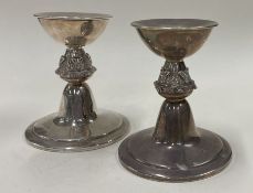 An unusual pair of silver candlesticks embossed with foxes. Birmingham 1965.
