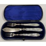 A fine three piece Victorian silver and mother of pearl cased sardine set.