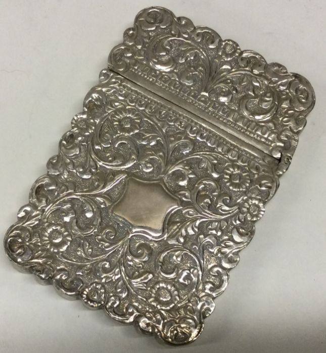 A heavy 19th Century Indian silver card case with chased decoration. - Image 2 of 2