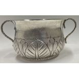 A fine Edwardian silver porringer in the style of Charles II. London 1913.