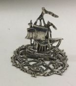 A heavy cast silver menu holder in the form of a ship. London. Approx. 39 grams.