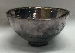 A textured silver bowl on pedestal foot. London. Approx. 40 grams.