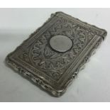 A good Victorian silver card case with engraved decoration.