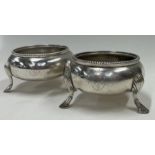 A pair of bead patterned Victorian silver salts. London 1885.