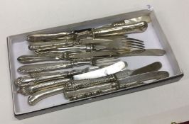 A large collection of silver mounted cutlery.