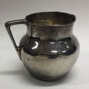 A heavy silver cream jug of plain form. London. Approx. 62 grams.