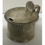 A George III silver mustard pot with chased border. London circa 1820.
