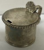 A George III silver mustard pot with chased border. London circa 1820.