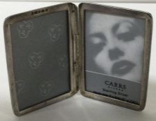 CARRS: A silver double photo frame. London 2004.