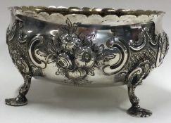 A chased Victorian bowl embossed with flowers. London 1862.