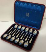 A set of twelve Victorian engraved silver spoons in original case. London 1881.