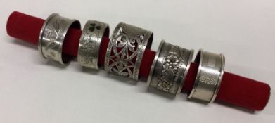 A group of five various silver napkin rings. Approx. 97 grams.