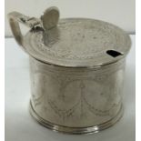 A good Victorian silver mustard pot with engraved decoration. London 1864.
