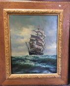 A framed canvas picture of a clipper at sea.
