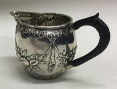 A good chased silver cream jug. London. Approx. 52 grams.