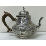An early chased 18th Century Dutch silver teapot. Approx. 284 grams.