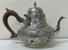 An early chased 18th Century Dutch silver teapot. Approx. 284 grams.