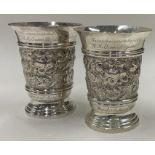 A pair of chased Jubilee silver beakers. Birmingham 1976. By DS Ltd.