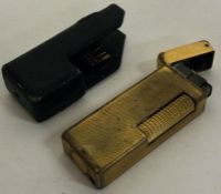 A Dunhill gold plated lighter in original Dunhill sleeve. Est. £20 - £30.