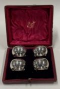 A cased set of four numbered silver napkin rings. Sheffield 1905.