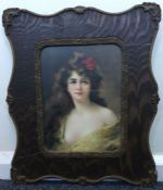 A decorative oak framed and glazed picture of a lady with long flowing hair.