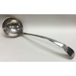 A heavy OE pattern silver soup ladle with crested decoration.