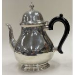 TIFFANY & CO: A large silver teapot.