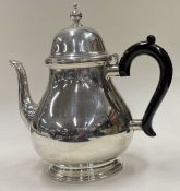 TIFFANY & CO: A large silver teapot.