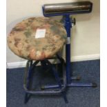 A metal stool together with a roller.