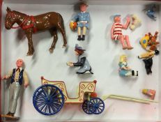 A collection of painted lead figures and cart.