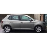 SKODA FABIA: A Skoda Fabia car with manual gearbox in beige with alloy wheels.