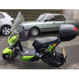 MERLIN X5: An electric scooter in lime green. Registration AE69 DFF.