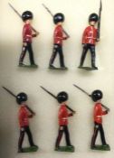A set of six lead soldiers in dress.