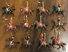 A large selection of painted lead horses.