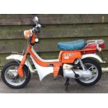 SUZUKI: An FZ50 moped in orange. Registration: HTT 220V.