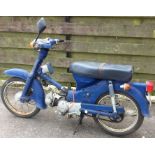 HONDA: A moped in blue.