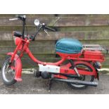 PUCH: A moped in red. Registration: C815 JOD.